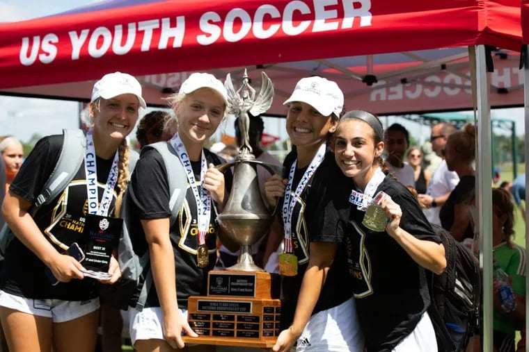 Players from the Philadelphia Soccer Club's Coppa Rage under-17 girls team celebrate after winning the U.S. Youth Soccer national championship at Disney's Wide World of Sports complex near Orlando, Fla., on July 24. (Left to right: Taylor Mays, Brigid McDonald, Alexis Ocasio, and Mercedez Paino.)