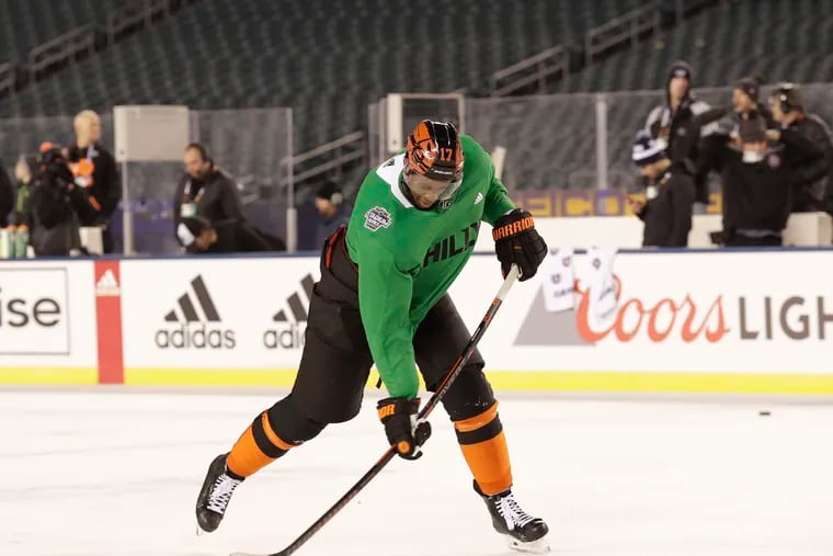 Flyers right winger Wayne Simmonds shoots the puck during practice at Lincoln Financial Field on Friday.  The Flyers face the Pittsburgh Penguins in a Stadium Series game Saturday night.