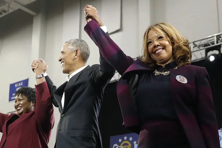 Democrat Lucy McBath (right), seen here standing with Georgia gubernatorial candidate Stacey Abrams and former President Barack Obama, was won a major upset in a solidly-Republican House district in Georgia.