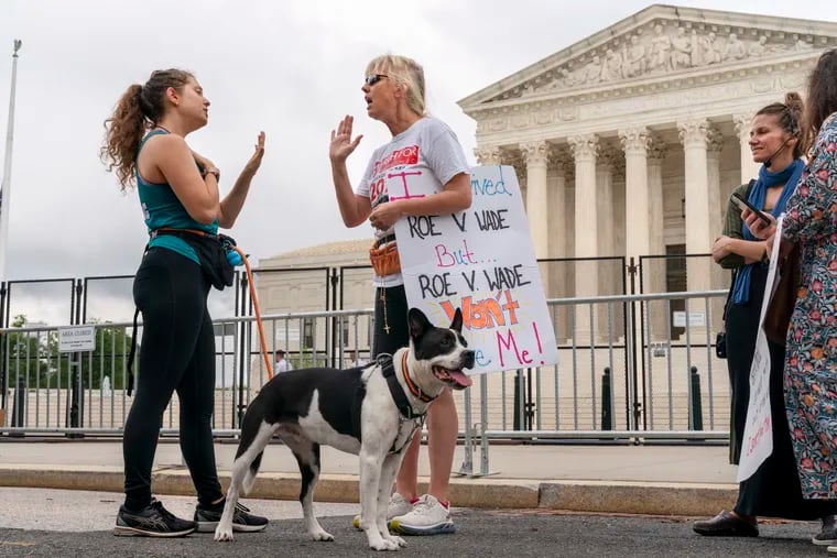 Lilo Blank, 23, of Philadelphia (left), who supports abortion rights, and Lisa Verdonik, of Arlington, Va., who is antiabortion, talk about their opposing views on abortion rights outside the Supreme Court Building in 2022. Kyle Sammin writes that the answer to our national discord is to live and let live.