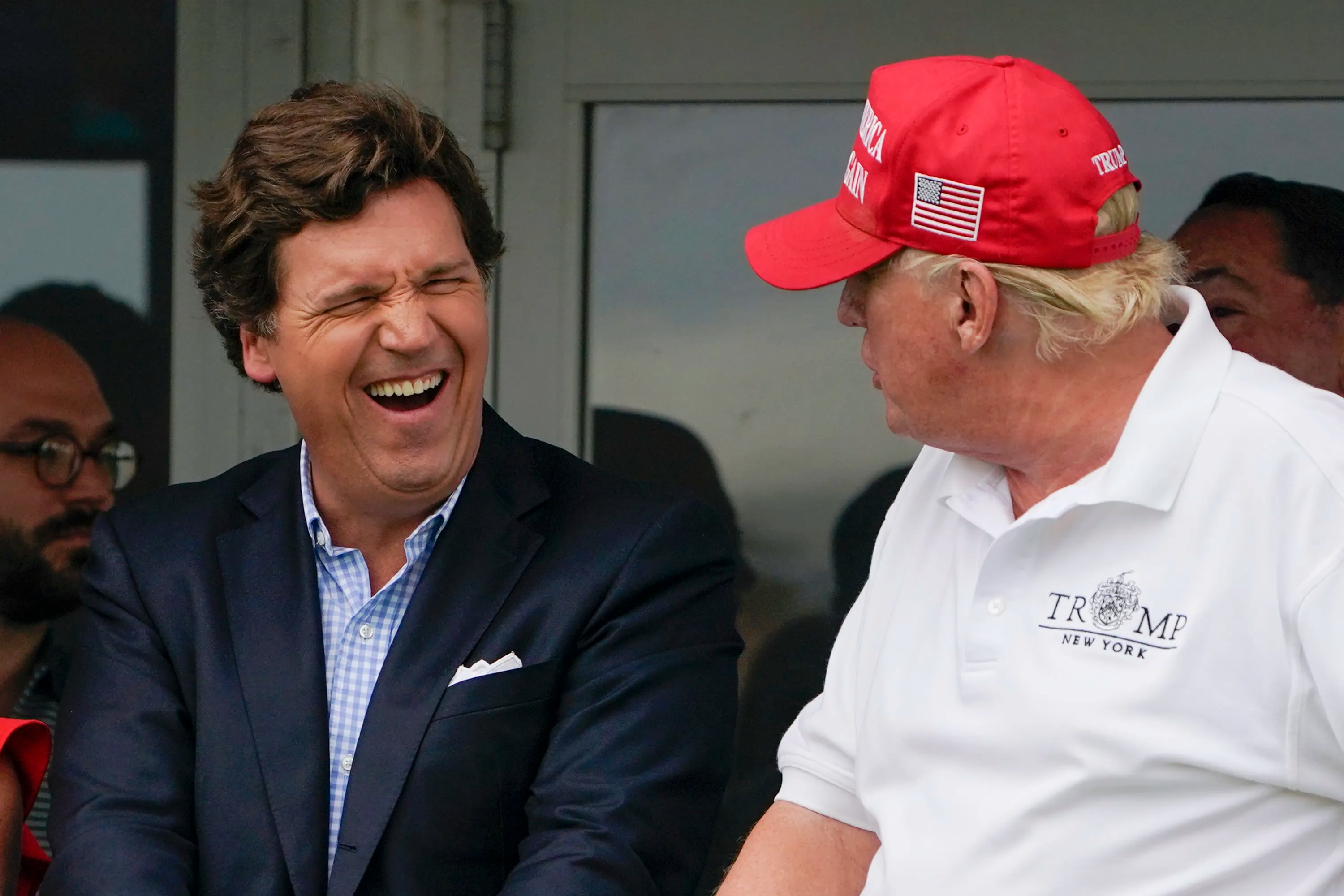 Former Fox News host Tucker Carlson, seen here with former President Donald Trump in July 2022.
