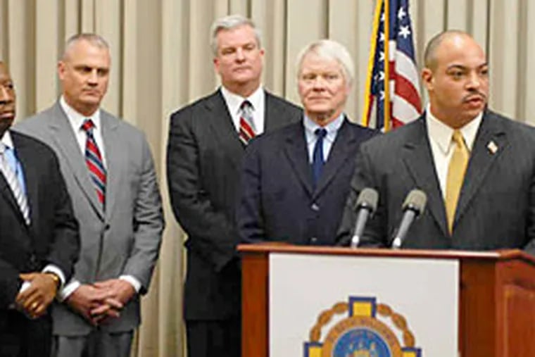 Among key staff appointments announced yesterday by D.A. Seth Williams is that of Christopher Werner (second from left) as chief of county detectives.
