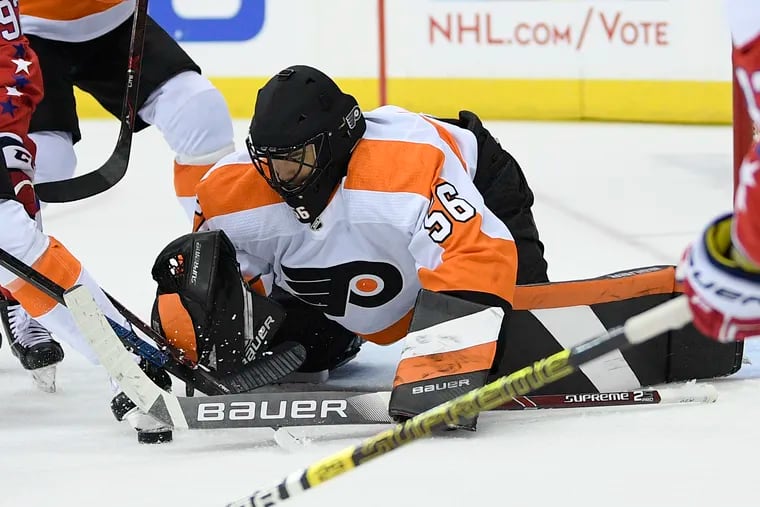 The Flyers tied an NHL record in Tuesday night's loss to Washington. By giving Mike McKenna the start, he became the seventh goaltender to play for the team this season. (Nick Wass / AP Photo)