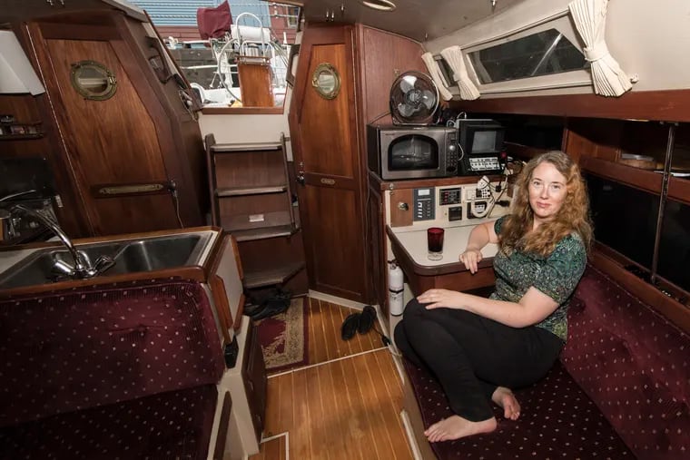 Claire McKellar, is photographed inside her 1989 Catalina 34 feet sailboat, at the Pier 3 Marina on 31 N. Columbus Blvd. in Philadelphia. About 20 people live year-round on boats on the Delaware river at Pier 3.