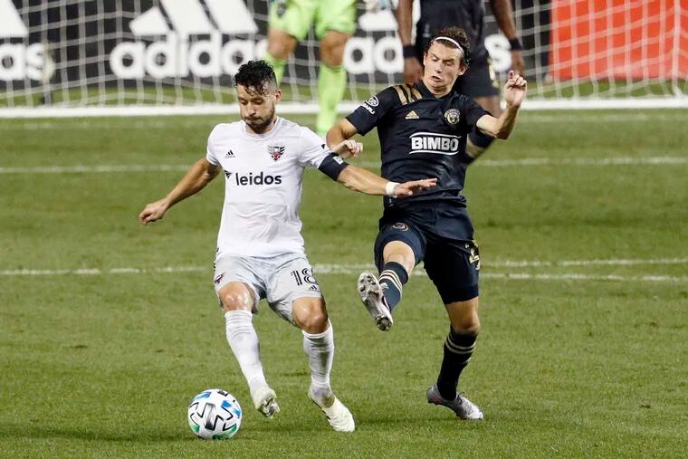 Brenden Aaronson, right, pressures Felipe Martins during the Union's win over D.C. United.