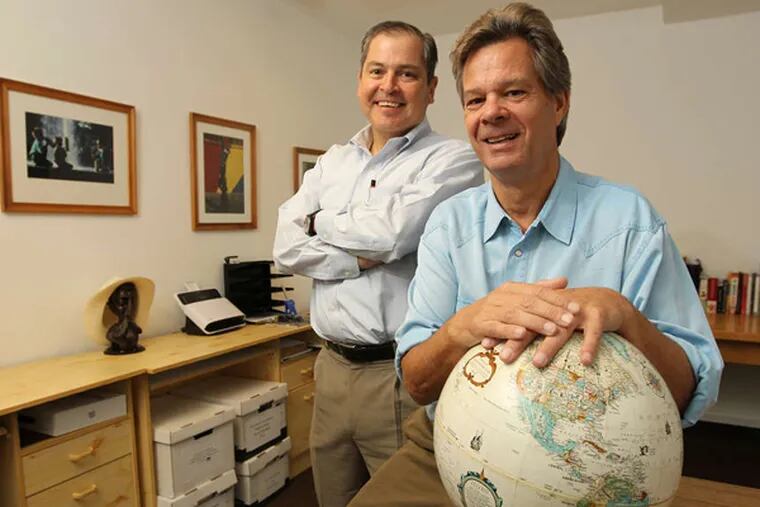 The educational travel firm Chill Expeditions in Ardmore is co-owned by Eddie Rodriguez (left) and Crawford Hill. (MICHAEL BRYANT/STAFF)