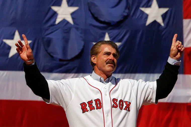 Former Boston Red Sox player Bill Buckner acknowledges the cheers from the crowd before throwing out the ceremonial first pitch at the MLB baseball game between the Boston Red Sox and Detroit Tigers on April 8, 2008 at Fenway Park in Boston.