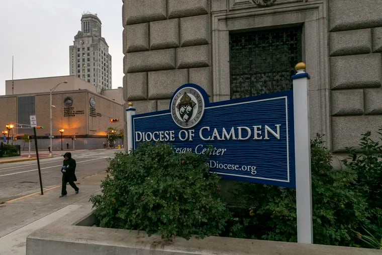 Pedestrians outside the Diocese of Camden at 631 Market St. in Camden.