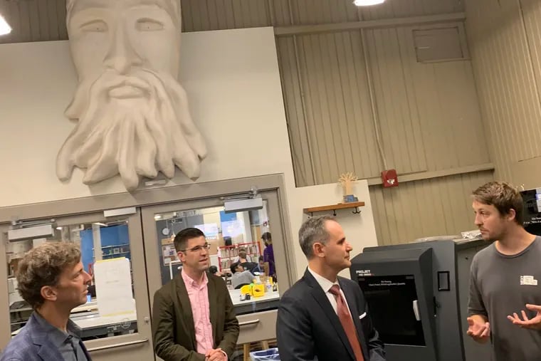 NextFab ceo Evan Malone, cfo Ken Tomlinson, SBA Acting Administrator Chris Pilkerton, NextFab site manager Scott Newcomb at NextFab’s South Philly site on Aug. 28, 2019, mark a $100,000 SBA grant to aid job creation. Above them is an image of the ancient Greek sea god Poseidon, enlarged and made via 3-D printer from a clay original. Malone is the founder, owner and boss at NextFab, whose three sites in Philadelphia and one in Wilmington enroll more than 1,200 members paying $25-300 a month to use 3-D printers, laser cutters and other digital tools. NextFab has also invested $7.5 million and offered business help to 23 of its most promising member start-up companies, and is recruiting investors to back more.