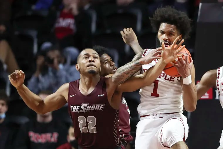 Temple Owls guard Damian Dunn (1) battles for a rebound against Maryland-Eastern Shore Hawks forward Nathaniel Pollard Jr. (22) in the first half of a game at the Liacouras Center in Philadelphia on Wednesday, Nov. 10, 2021.