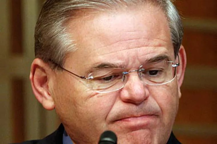 In this June 17, 2009, file photo, Senate Energy and Natural Resources Committee member Sen. Robert Menendez, D-N.J., listens during the committee's markup hearing on energy legislation on Capitol Hill in Washington. (AP Photo/Harry Hamburg, File)
