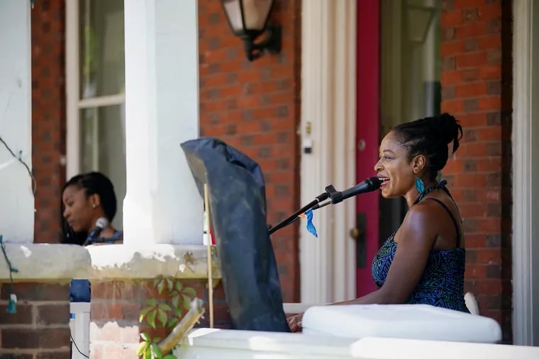 Joy Ike performs during PorchFest in West Philadelphia. The annual music festival was canceled last year due to the coronavirus pandemic but returned this year to feature some 260 musical acts across more than 135 porches.