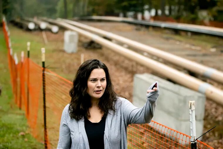 In this Tuesday, Oct. 22, 2019 photo, Carrie Gross speaks during an interview with The Associated Press along the Mariner East pipeline in Exton, Pa. The pipeline route traverses those suburbs, close to schools, ballfields and senior care facilities.