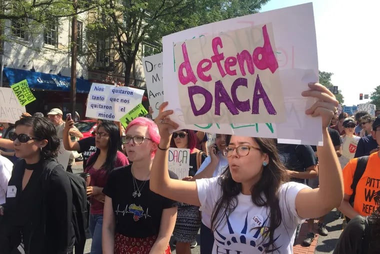 Pro-DACA demonstrators rally outside the  Department of Justice offices at Second and Chestnut Streets on Tuesday morning.