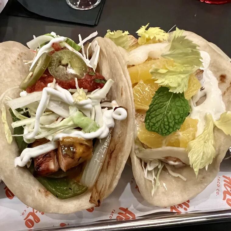 Chicken fajita taco (left) and a grilled fish taco at Hi-Lo Taco Co.