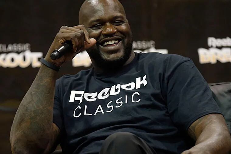 Former NBA player Shaquille O'Neal laughs during a panel discussion at the 2014 Reebok Classic Breakout. (Yong Kim/Staff Photographer)