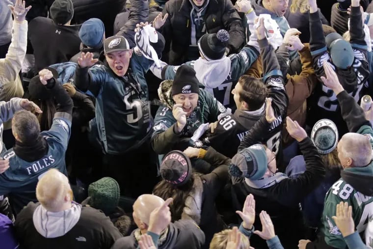 Fans celebrate after Eagles Alshon Jeffery scores Eagles 3rd TD of the game during the Vikings vs Eagles NFC Championship football game at Lincoln Financial Field in Phila., Pa. on Jan. 21, 2018.