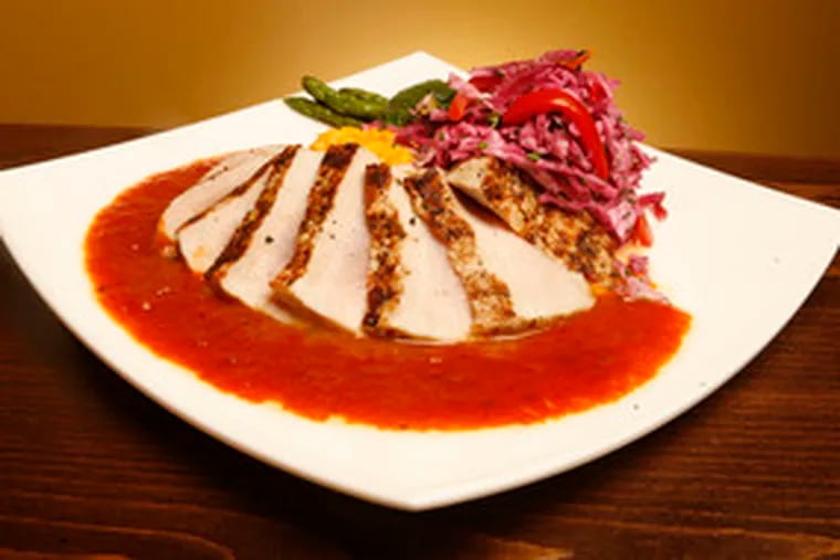 The pork loin, served with mashed sweet potatoes and chipotle barbecue sauce, shows the kitchen&#0039;s successful side.
