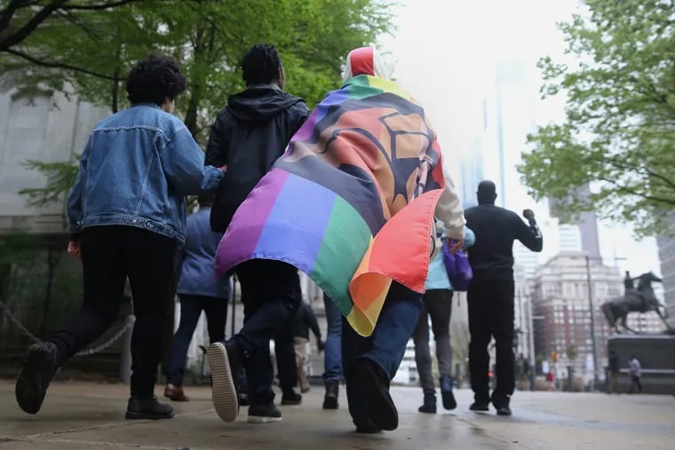 Participants march around City Hall in the first-ever Black Pride parade in Center City in April 2018.