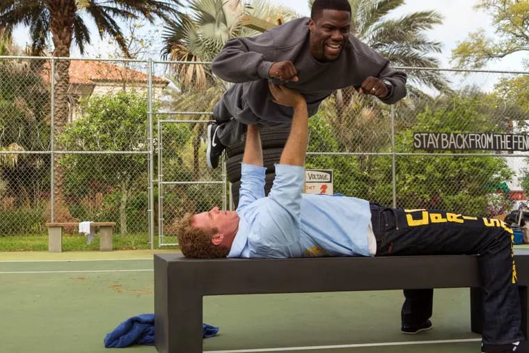 Will Ferrell prepares for prison by bench-pressing Kevin Hart. (AP Photo/Warner Bros. Entertainment Inc., Patti Perret)