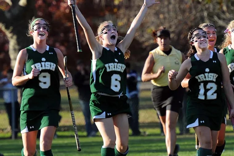 Camden Catholic beat Collingswood, 4-0, for the Central Jersey Group 2 field hockey championship. Celebrating their victory are (from left) Tara Vittese, who scored two of the goals, Brianna Cahill and Danielle Frasca.