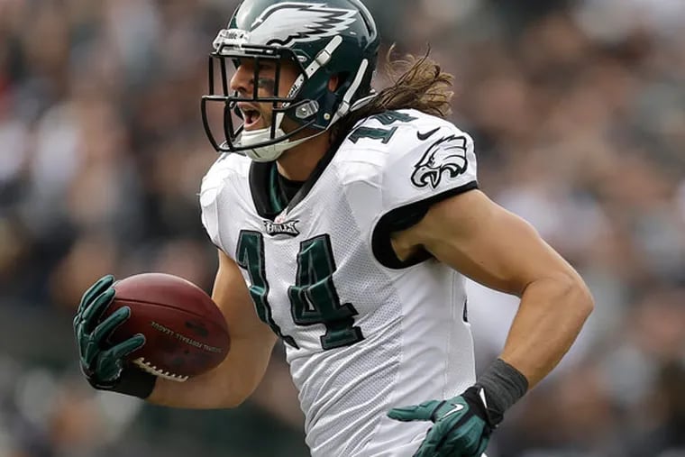 Riley Cooper (14) scores on a 63-yard touchdown reception from quarterback Nick Foles during the second quarter of an NFL football game against the Oakland Raiders in Oakland, Calif., Sunday, Nov. 3, 2013. (Ben Margot/AP)