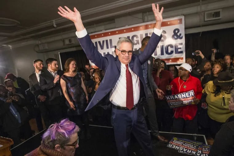 Democratic nominee Larry Krasner raises his arms as he leaves the stage after winning the election to be the next Philadelphia District Attorney on Nov. 7, 2017.