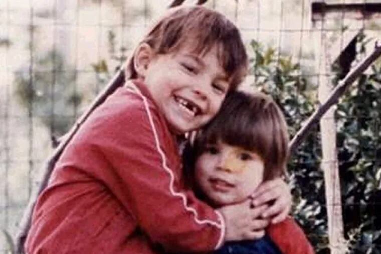 Daniel Dougherty Jr. (left) and his younger brother, John, died in 1985 in an arson fire attributed to their father.