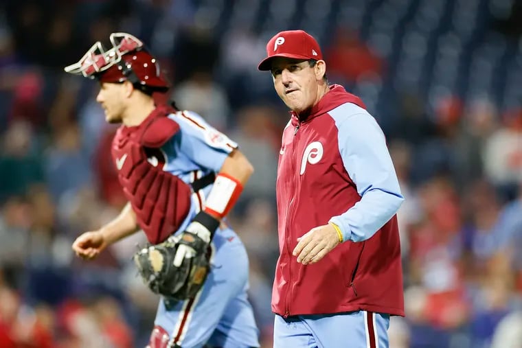 Phillies Interim Manager Rob Thomson with catcher J.T. Realmuto after a Phillies pitching change against the Atlanta Braves on Thursday, September 22, 2022 in Philadelphia.