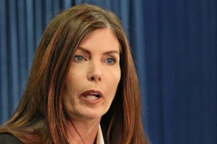 Pennsylvania Attorney General Kathleen Kane explains a point to a reporter about Case File No. 36-622 during her press conference in Harrisburg on Monday. Attorney General Kathleen Kane makes her first public appearance after The Inquirer reports that she shut down an undercover investigation that captured five Philadelphia Democrats on tape. She says the investigation was flawed and a criminal case would not have succeeded in court.  03/17/2014  ( MICHAEL BRYANT / Staff Photographer )