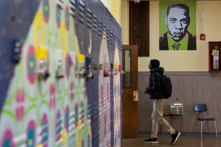 A student walks into a classroom at Jay Cooke Elementary in North Philadelphia last year. Philadelphia is among the school districts most shortchanged by the way Pennsylvania funds public education, according to a new analysis in a lawsuit challenging the system.