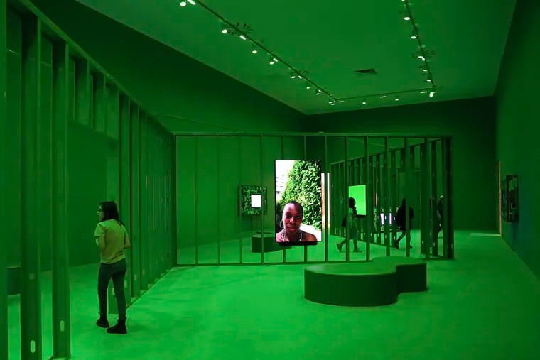 Visitors to the Philadelphia Museum of Art Saturday walk though "Neural Swamp," a video installation by Martine Syms.