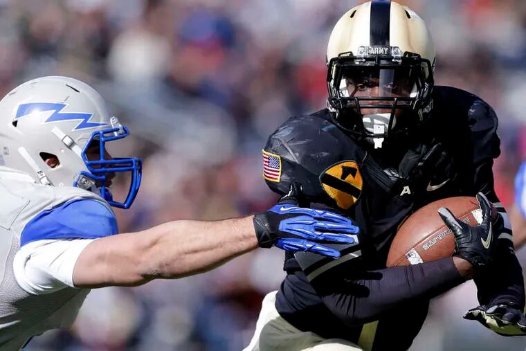 Army running back Raymond Maples (1) has 1,059 yards on the ground and is averaging 5.4 yards per carry. MIKE GROLL / Associated Press