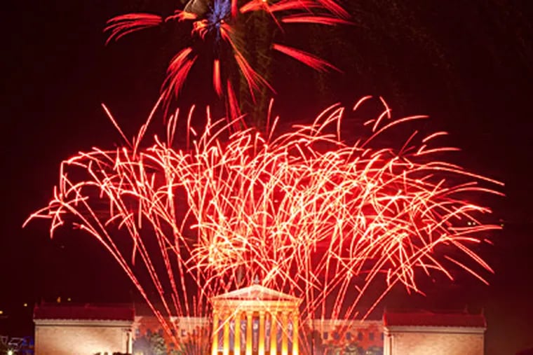 Fireworks explode over the Art Museum on the Benjamin Franklin Parkway as Philadelphia celebrates the Fourth of July. Earlier, Mayor Nutter spoke at Independence Hall, but the festivities were marred by the shootings of three people near the Parkway at night. ED HILLE / Staff Photographer