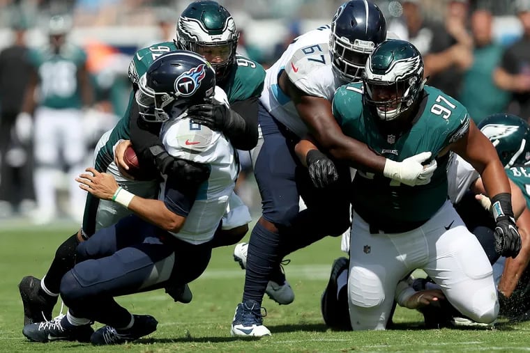 Marcus Mariota is sacked by the Eagles' Derek Barnett in the second quarter.