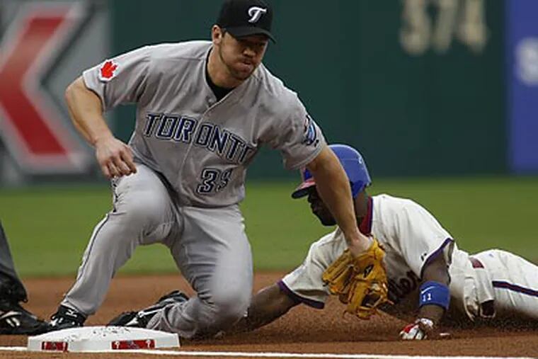 Jimmy Rollins (above) and Shane Victorino were caught stealing in key situations. (H. Rumph Jr/AP)
