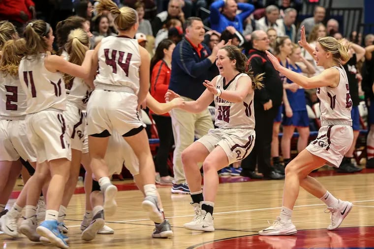 The Garnet Valley girls' basketball team celebrates after beating Neshaminy, 51-48, in the PIAA Class 6A semifinals in Plymouth Meeting. The Jaguars will face Peters Township in the state final Friday in Hershey.