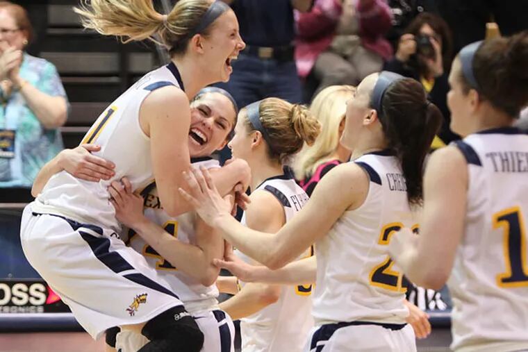 Drexel's Hollie Mershon jumps for joy with her teammates after beating
Florida during the NIT Semi-finals at the Daskalakis Athletic Center
in Philadelphia, Wednesday, April 3, 2013. (Steven M. Falk/Staff Photographer)
