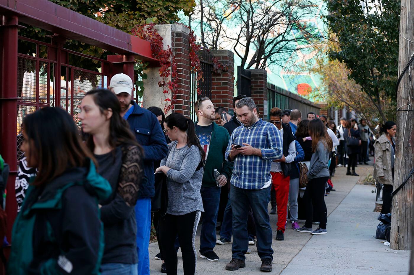 Voters stretch a block long along Third Street to vote at the Northern Liberties Community Center on Election Day in Philadelphia in 2016. Voters said they waited two hours in line. 