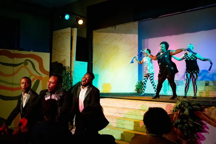 Members of the male cast, including Pierce Williams as Seneca (left), Jaron C. Battle as Cinemas (center), and William Morris (left) as Castor, perform in the musical, "Lysistrata, Cross your legs, Sister!"