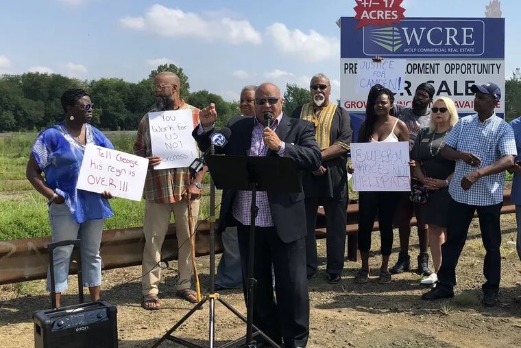 Amir Khan, with the Camden We Choose coalition, speaks at a press conference on the city's need for a supermarket on Aug. 15, 2019. Residents and community organizers taking part in the event gathered in front of a vacant lot, along Admiral Wilson Boulevard.