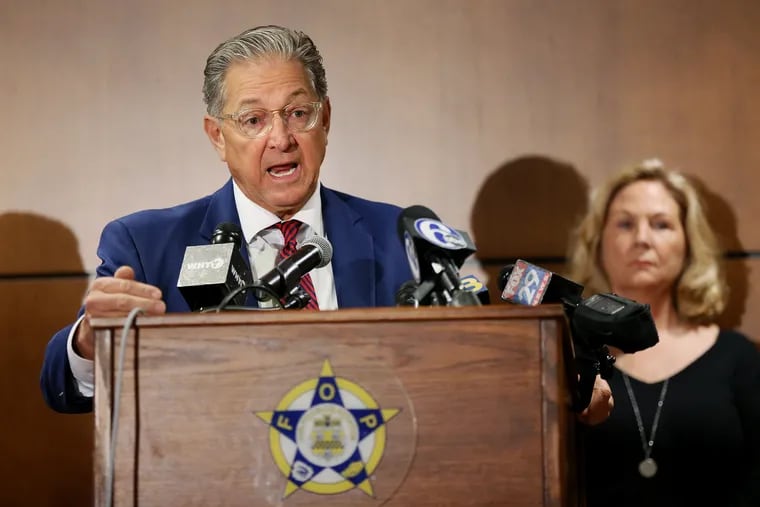 Attorney George Bochetto, left, speaks during a news conference at the Fraternal Order of Police in Northeast Philadelphia on Tuesday, Nov. 12, 2019, to announce that he has filed a petition in the state Supreme Court on behalf of Maureen Faulkner, right, seeking to get the Philadelphia District Attorney's Office disqualified from handling appeals by Mumia Abu-Jamal, who was convicted of the 1981 murder of Police Officer Daniel Faulkner.