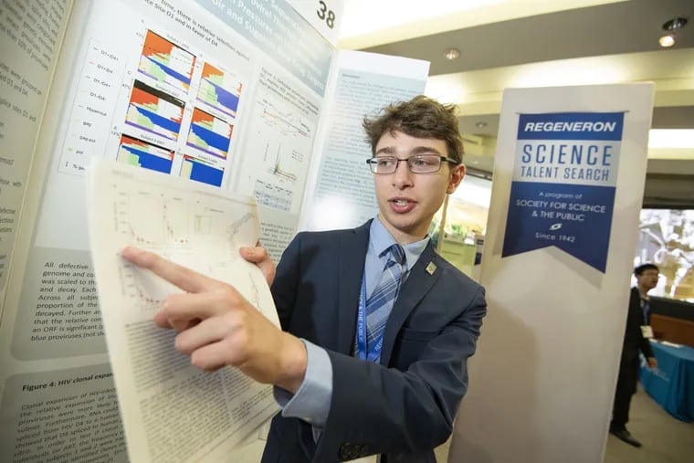 Sam Weissman with his HIV project at the prestigious Regeneron Science Talent Search in Washington, DC, where he won second place and $175,000 in prize money.
