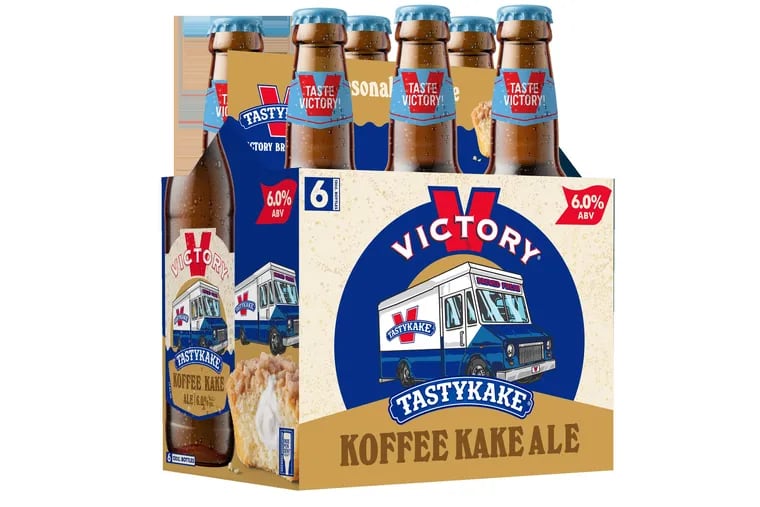 A six-pack of Victory Brewing Company's Tastykake Koffee Kake Ale features a photograph of a creme-filled Koffee Kake cupcake and an image of the iconic Tastykake box truck.