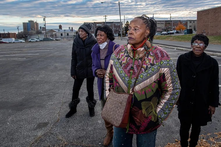 Beverly White (from left), Betty Drayton-Johnson, Paula Peebles, and Edna Funderburk at a parking lot near the 1600 N. 11th St. between the Yorktown and Jefferson Manor neighborhoods. Peebles and others object to the proposal to built apartments on that location, and say it will destroy the single-family home nature of their neighborhoods.