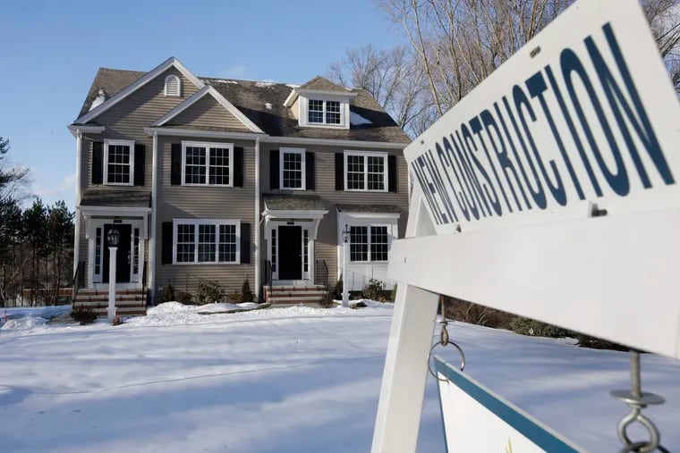 FILE - In this Feb. 21, 2019, file photo a sign is posted near a newly constructed home in Natick, Mass. On Tuesday, April 23, the Commerce Department reports on sales of new homes in March. (AP Photo/Steven Senne, File)