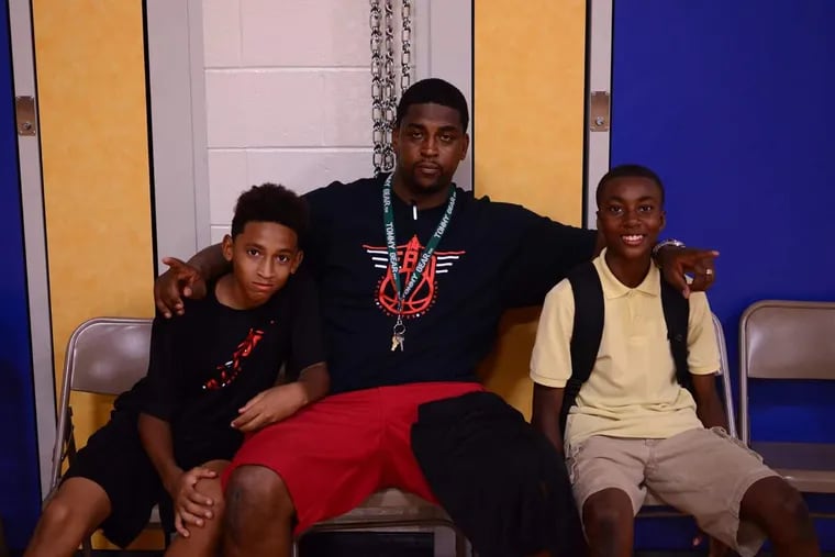 Terrell Baker (center) with his son, Terrell Baker Jr. (left), and family friend Anthony Robinson.