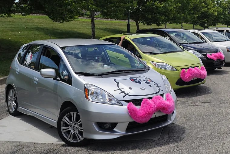 Lyft, with its cars in fanciful trim for a parade, is another affected ride-share service.