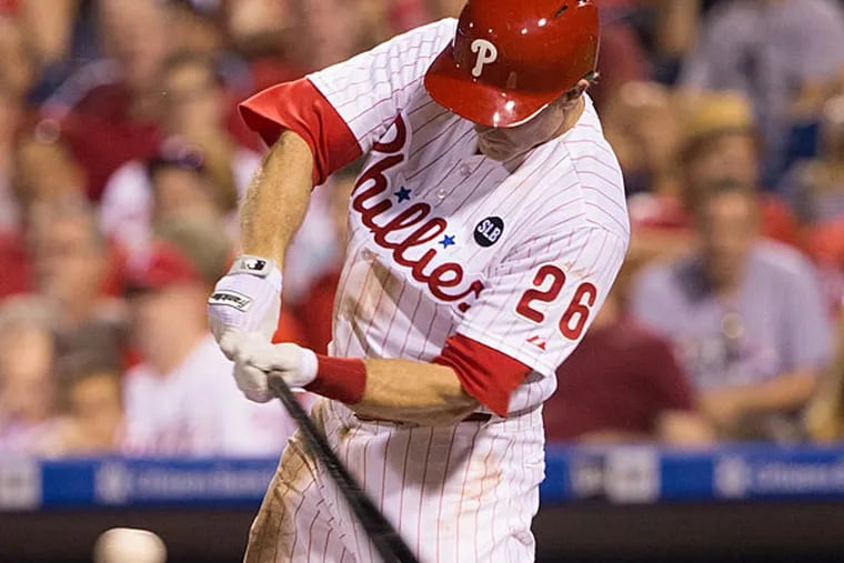 Philadelphia Phillies second baseman Chase Utley (26) hits a single during the seventh inning against the Toronto Blue Jays at Citizens Bank Park. The Blue Jays won 8-5.