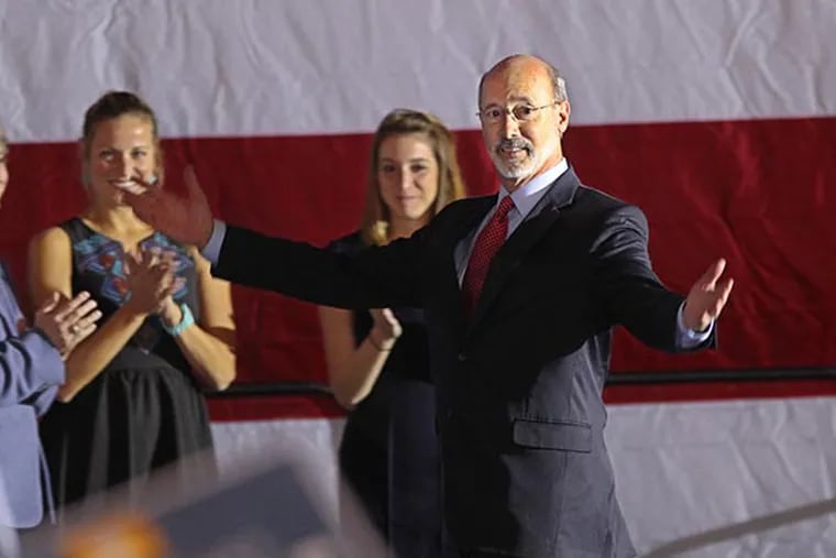 Governor elect Tom Wolf enters the Utz Arena with his family after Corbett's concession speech Tuesday night.  ( MICHAEL BRYANT  / Staff Photographer )